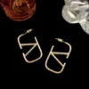 SHEIN V-Shaped Letter Bare Gold-Plated Earrings